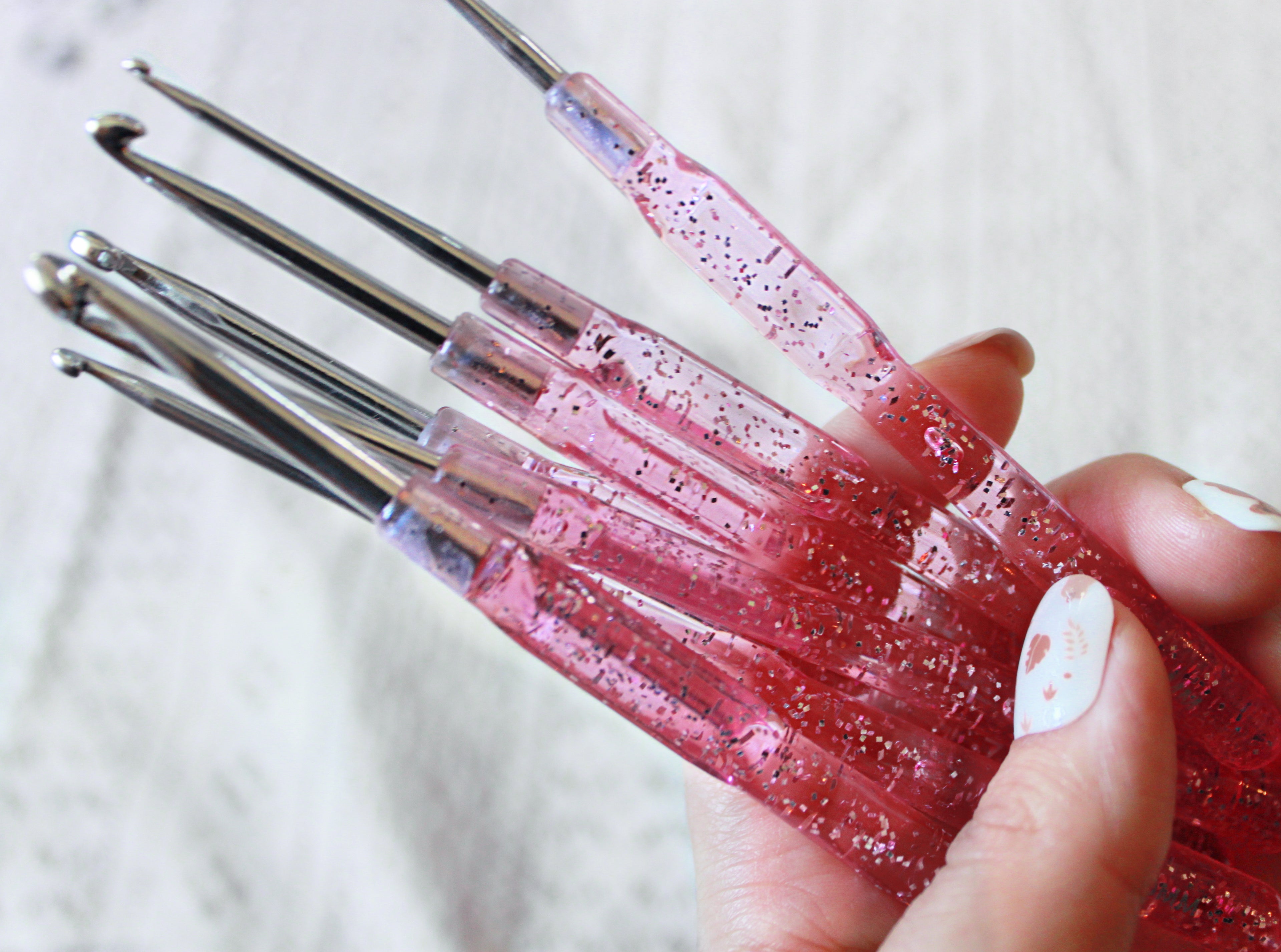 Clear set of pink crochet hooks with glitter