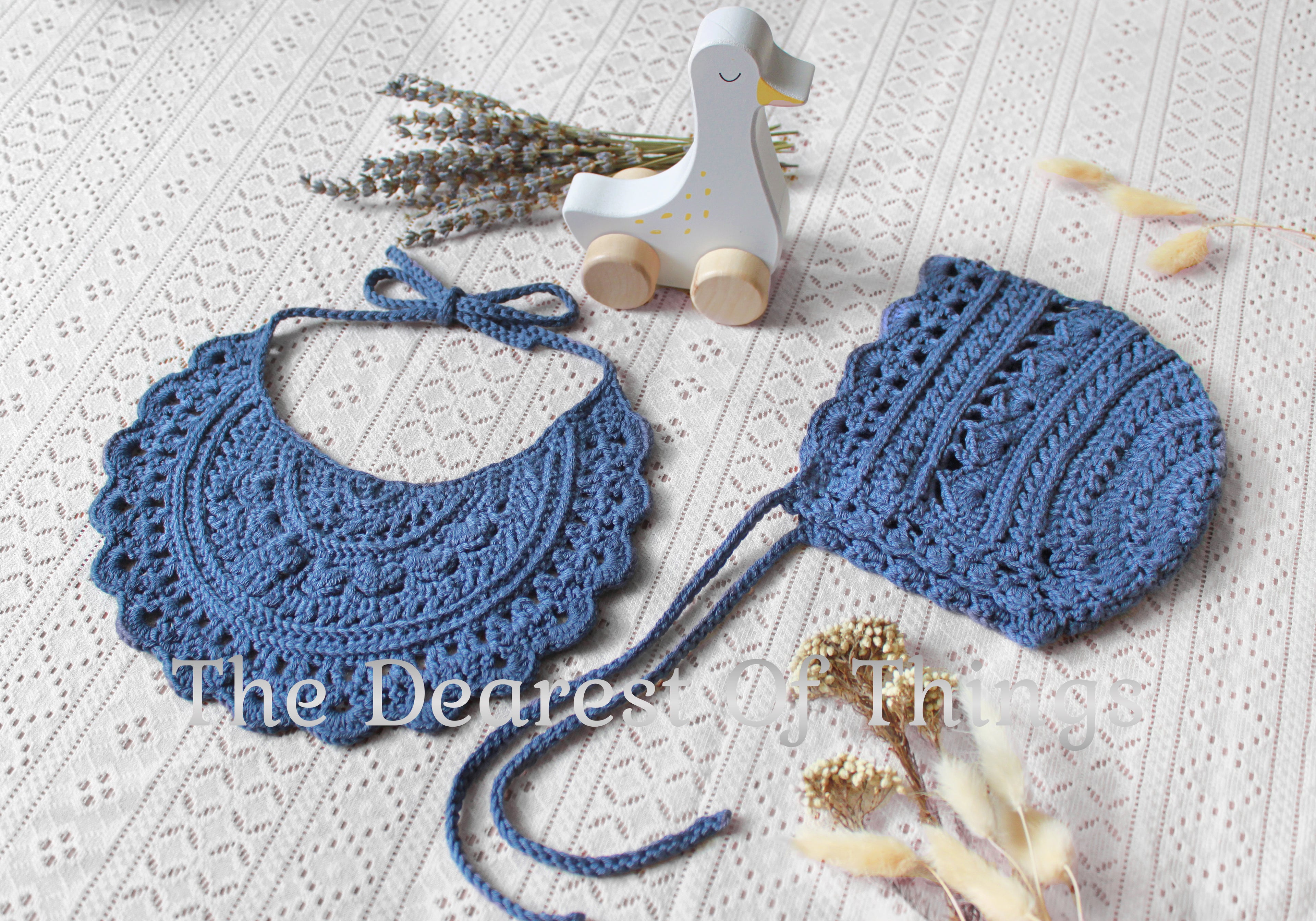 Blue colored lace baby bib and bonnet set