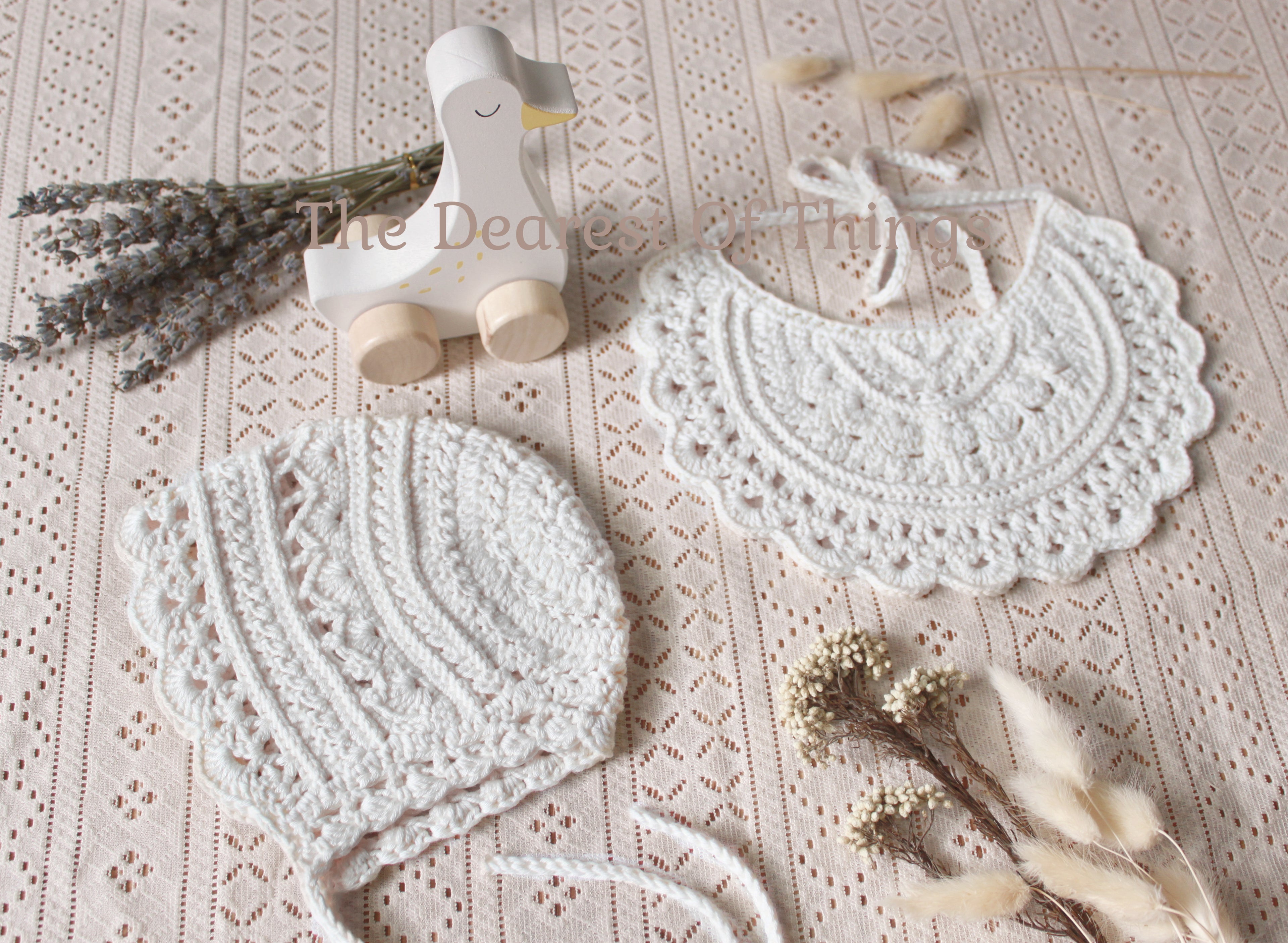 White crochet lace baby bib and bonnet set