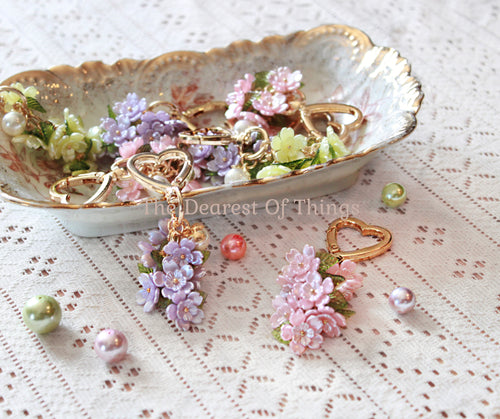 Flower keychain bag accessories with gold clips in pink, purple and yellow