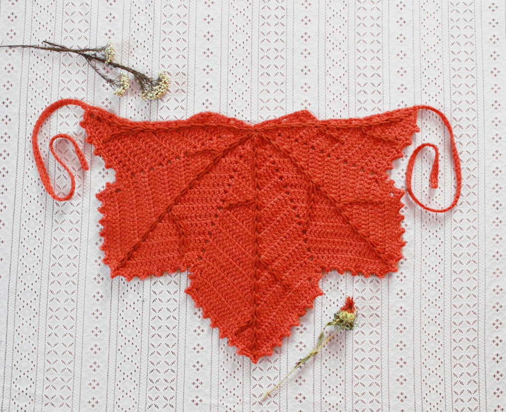An orange leaf shaped bandana for autumn. Winter hat boho fashion.