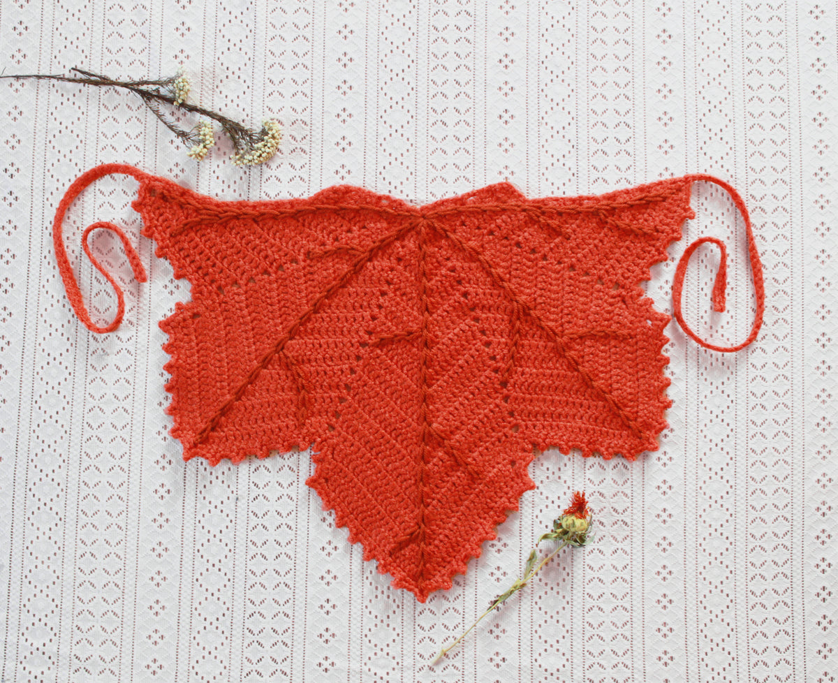 An orange leaf shaped bandana for autumn. Winter hat boho fashion.