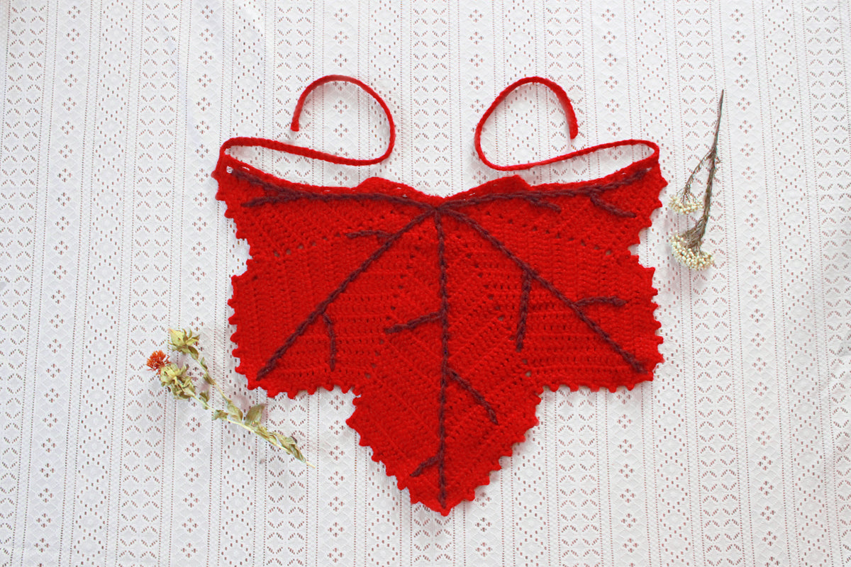 A red leaf shaped bandana for autumn. Winter hat boho fashion.