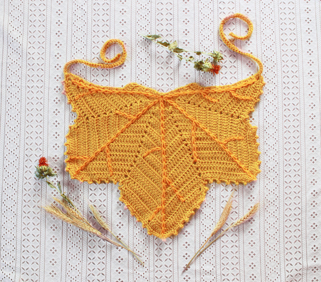 A yellow leaf shaped bandana for autumn. Winter hat boho fashion.